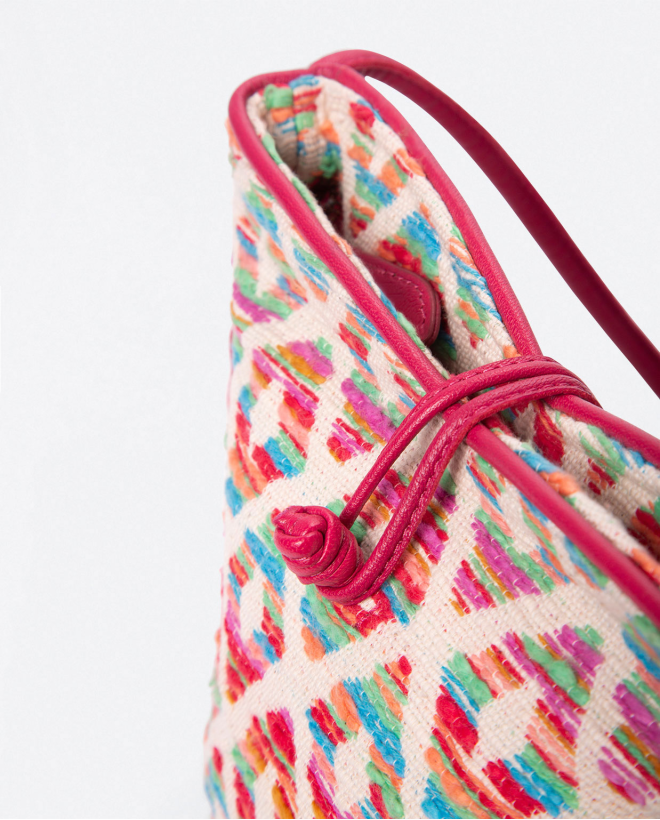 Petit sac à bandoulière. Fermeture par bouton. Imp Fushia