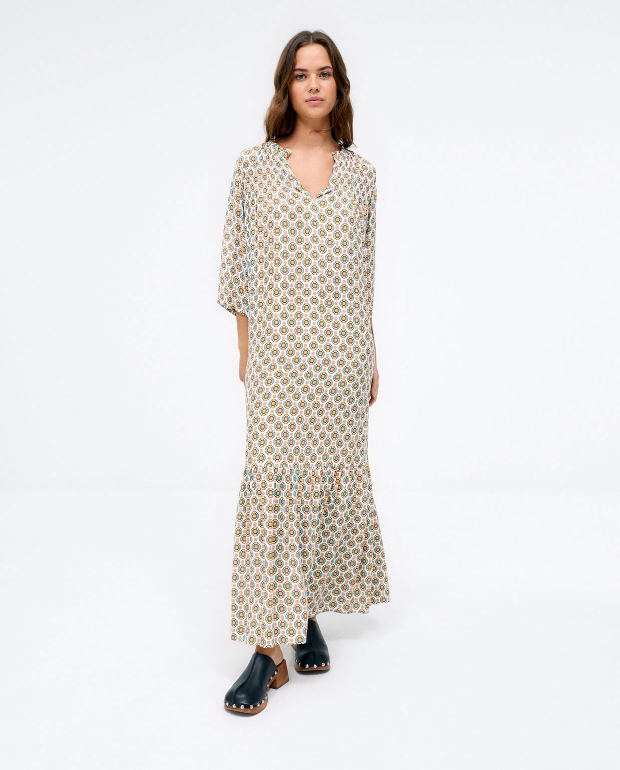 Long flowing dress with ruffle. Yellow