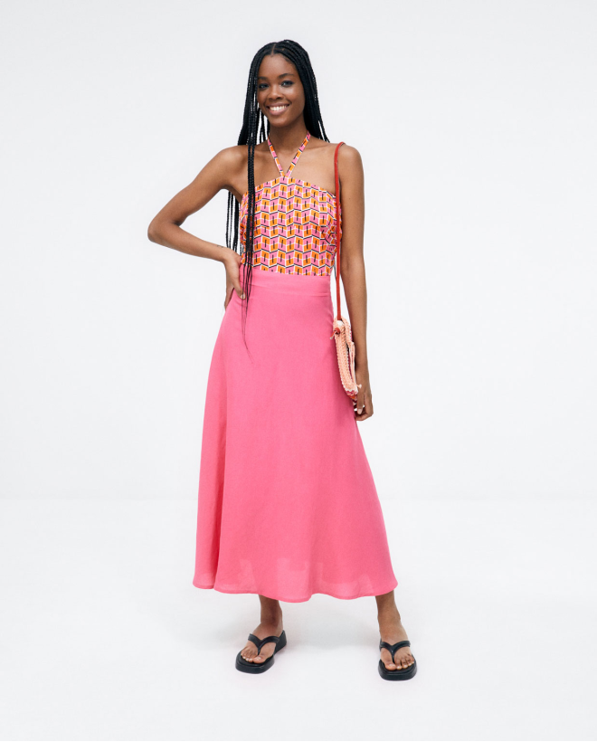 Gonna midi svasata in maglia. Fucsia