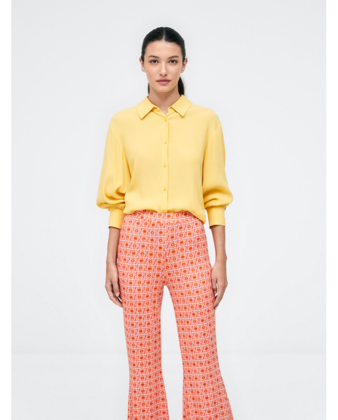 Pantalón largo campana. Elástico. Estampado Naranja