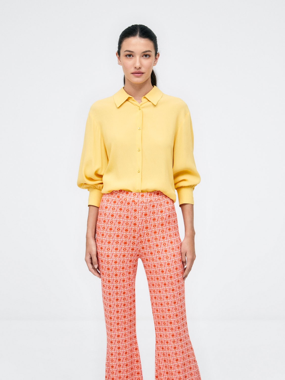 Pantaloni lunghi a campana. Elastico. Stampa Arancione