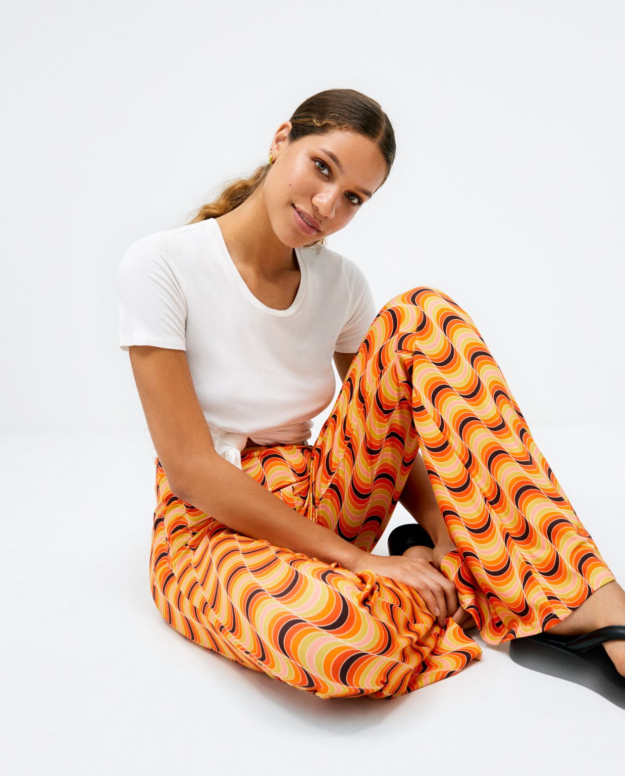 Pantalon long à fond de cloche. Elastique. Imprimé Orange