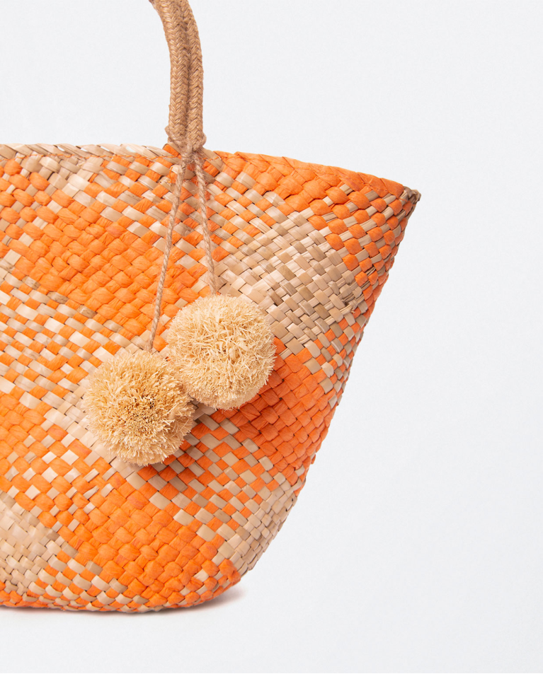 Jute basket with handles and pompoms. Stripes. Orange
